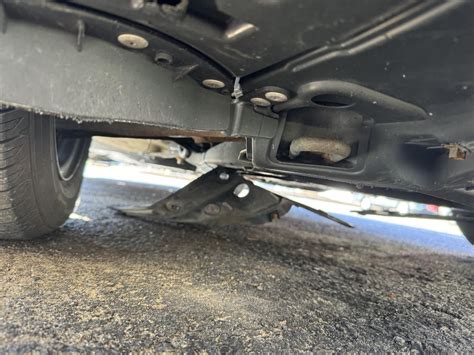 metal sheet hanging under car|metal hanging under car exhaust.